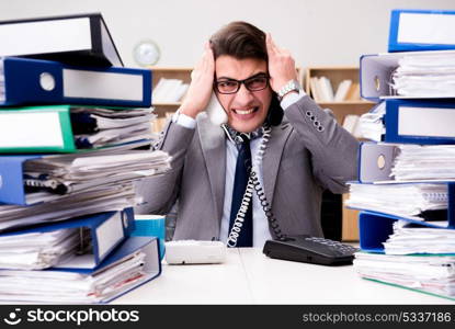 Busy businessman under stress due to excessive work