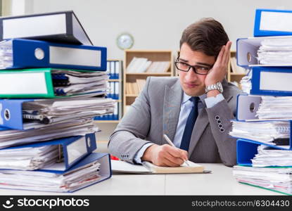 Busy businessman under stress due to excessive work