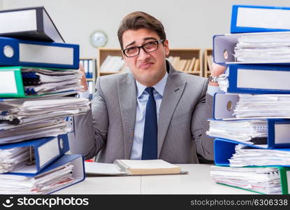 Busy businessman under stress due to excessive work