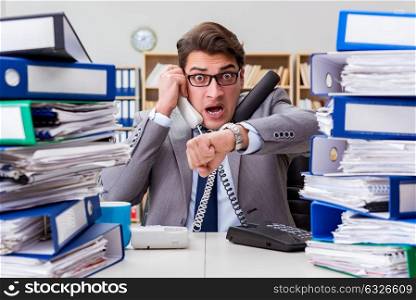 Busy businessman under stress due to excessive work