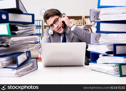 Busy businessman under stress due to excessive work