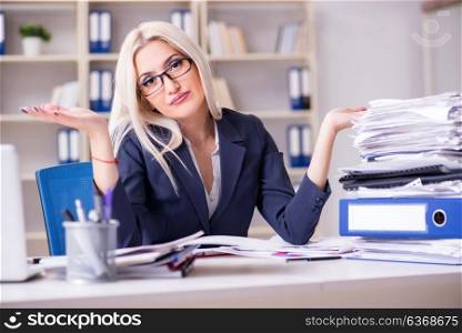 Busy businesswoman working in office at desk