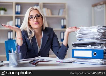 Busy businesswoman working in office at desk