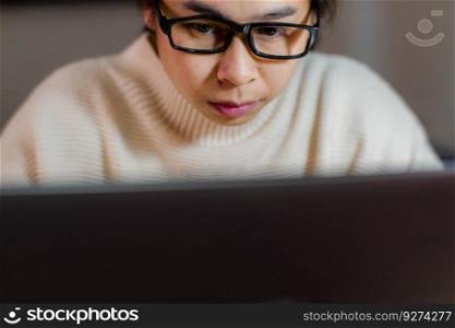 Busy businesswoman working on laptop computer in office. Confident young woman in casual clothes using laptop while working at home.