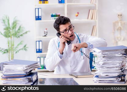 Busy doctor with too much work in hospital