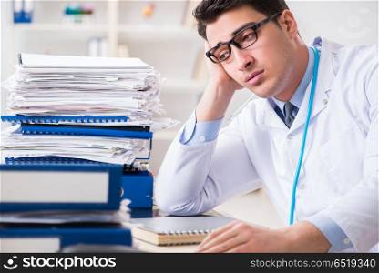 Busy doctor with too much work in hospital