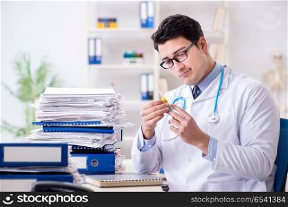 Busy doctor with too much work in hospital