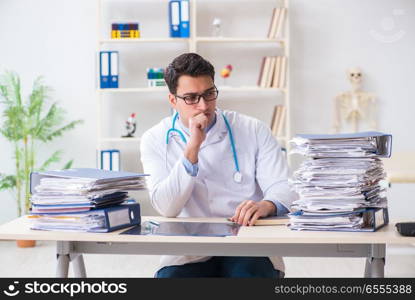 Busy doctor with too much work in hospital