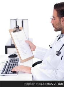 busy doctor working with his reports in his desk