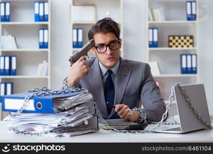 Busy employee chained to his office desk