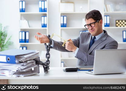 Busy employee chained to his office desk