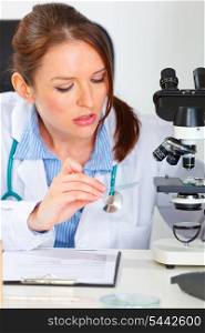 Busy female medical doctor working sample in laboratory&#xA;