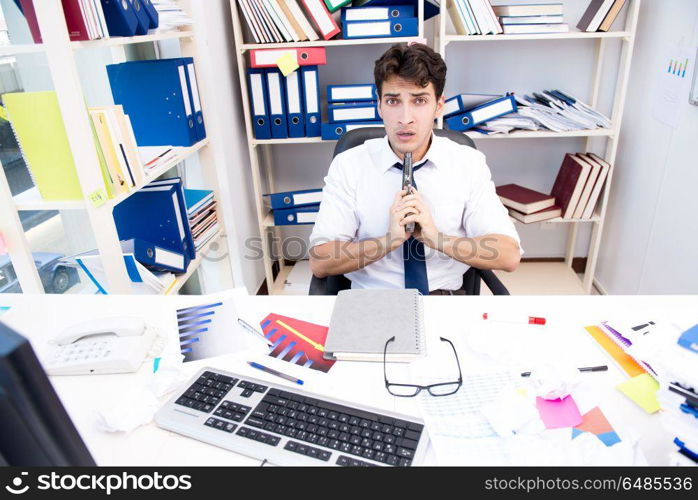 Busy frustrated businessman angry in the office