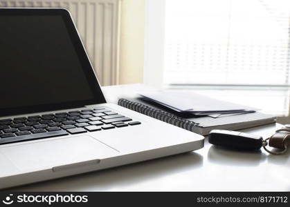 busy home desk paper laptop view