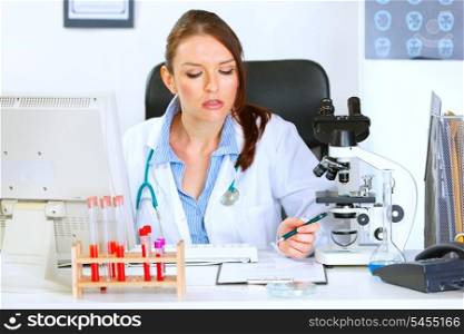 Busy medical doctor woman working at her office&#xA;