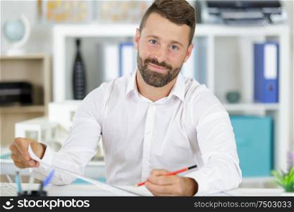 busy smiling man in office