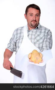 Butcher holding chicken
