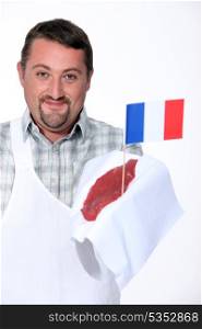 Butcher holding French beef