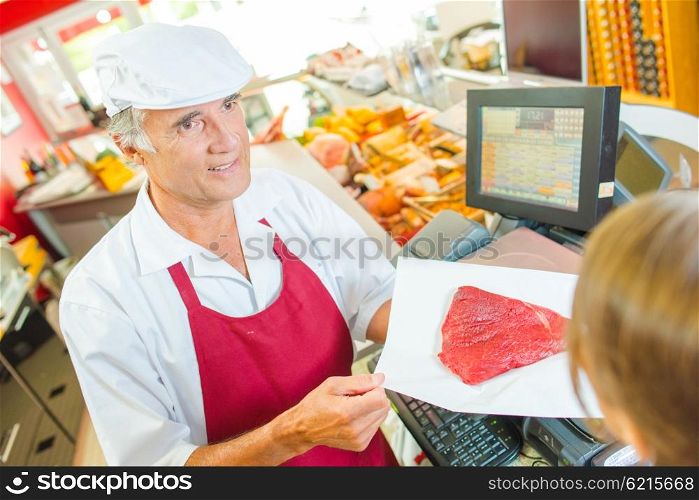Butcher running his own shop