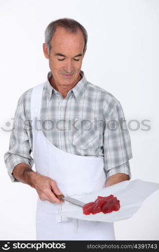 Butcher serving steak