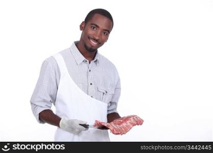 Butcher with a rack of ribs