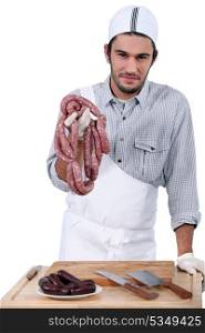 Butcher with sausages