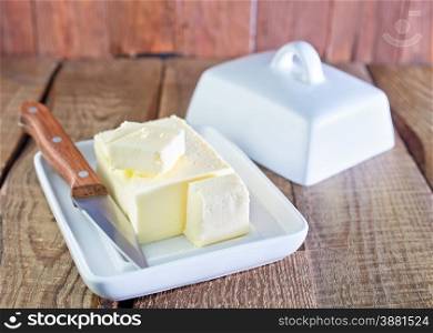 butter and knife on the wooden table