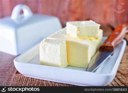 butter and knife on the wooden table