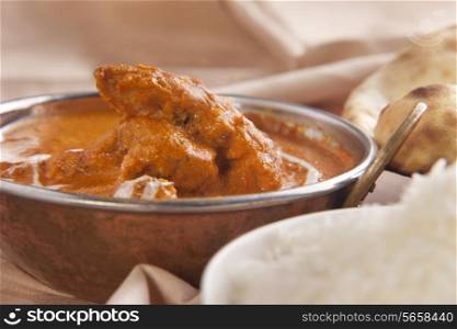 Butter chicken served in container