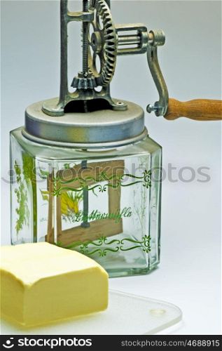 butter churn with a pice of butter. butter churn