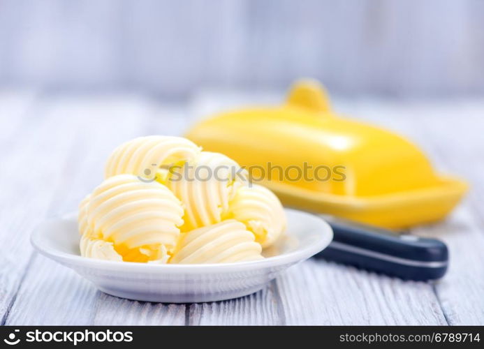 butter on plate and on a table