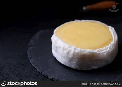 Butter soft creamy sheep cheese from Seia region Portugal on slate board