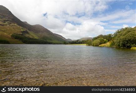 Buttermere lake in Lake District in England looking down length of the water