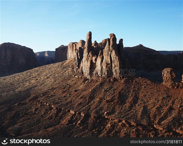 Buttes in southwestern desert landscape of Monument Valley, Utah.