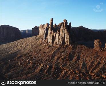 Buttes in southwestern desert landscape of Monument Valley, Utah.