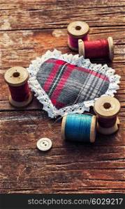 button and spools of thread for needlework