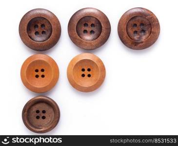 Button isolated at white  background. Wooden buttons collection closeup