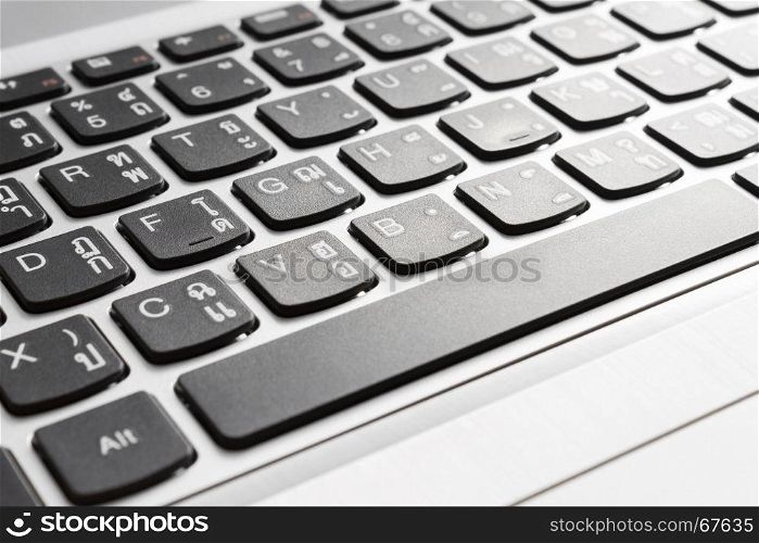 Button of laptop or notebook in close up view. Office supply concept