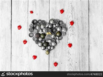buttons are laid out in the shape of heart for Valentine's day