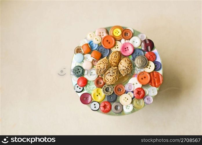 Buttons collection as decoration on cloth background