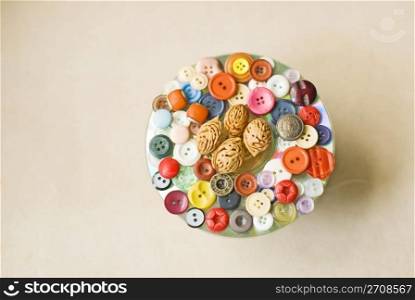 Buttons collection as decoration on cloth background