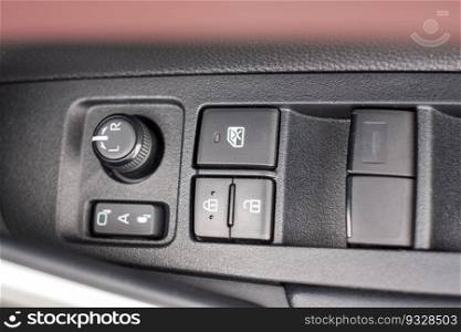 buttons controlling the windows inside a car, control and electric mirror adjustment