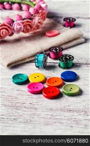 Buttons of different colors and accessories for needlework. Set of colored buttons
