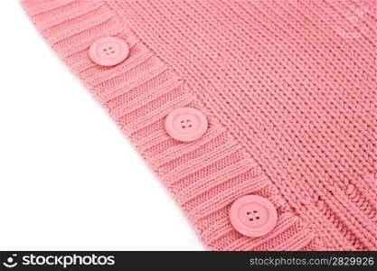 Buttons on pink sweater.