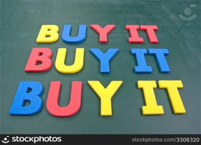 Buy it, colorful words on blackboard, marketing concept