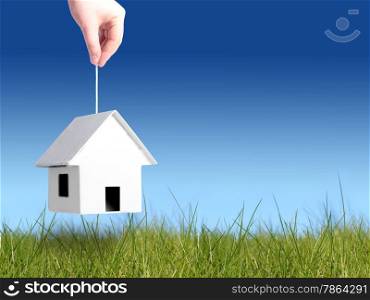 Buy new house concept. Over blue sky background.