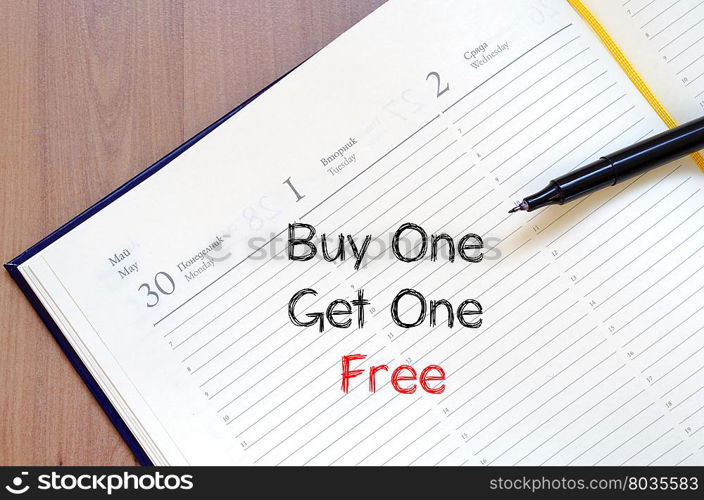 Buy one get one free text concept write on notebook