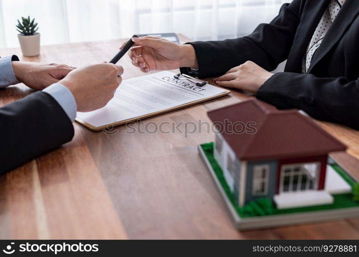 Buyer sign house loan contract with satisfaction after agree to term and condition of house loan with real estate agent. Contract document with client’s signature as housing business concept. Jubilant. Buyer sign house loan contract with satisfaction after agree to term. Jubilant