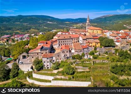 Buzet. Idyllic hill town of Buzet in green landscape aerial view. Istria region of Croatia.