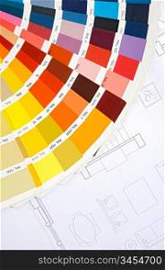 By choosing the colors of the new house on plans